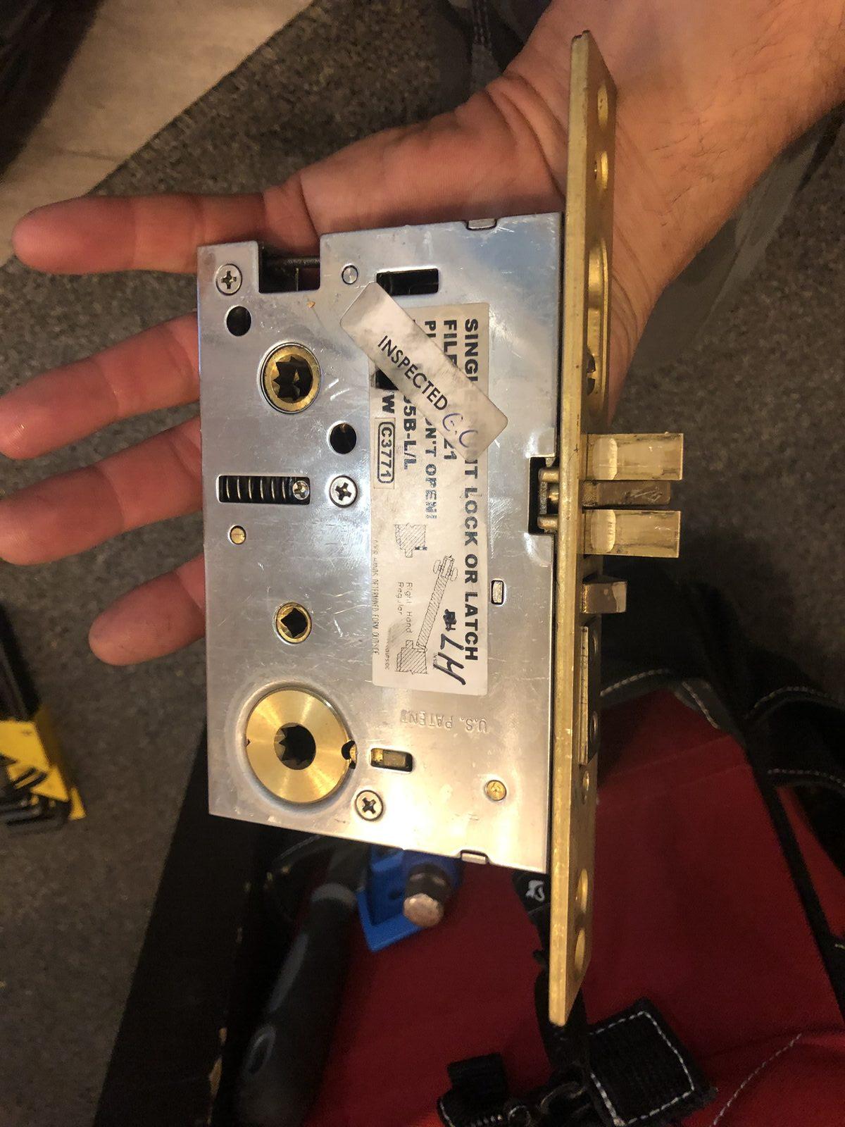 Storefront handle and lock hardware secured after damage